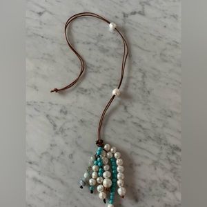 Salt water Pearl on leather with turquoise and crystal.